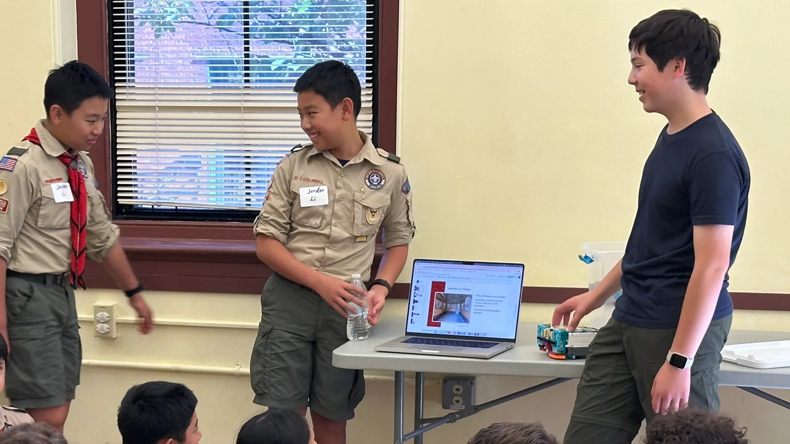 The team presenting their Innovation Project to scouts at the Harvard Archaeology Museum